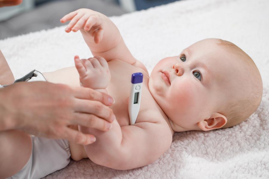 baby with thermometer